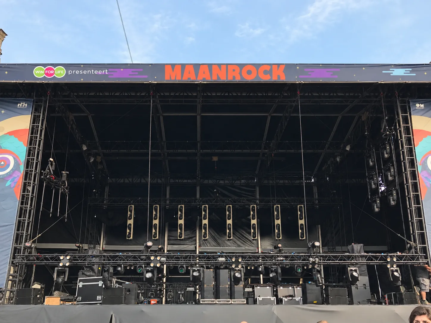The Maanrock stage set up before the event, with its festival banner and lighting rig.